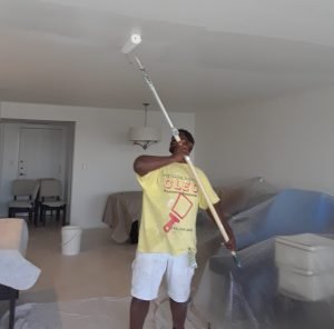 Cleo painting a ceiling